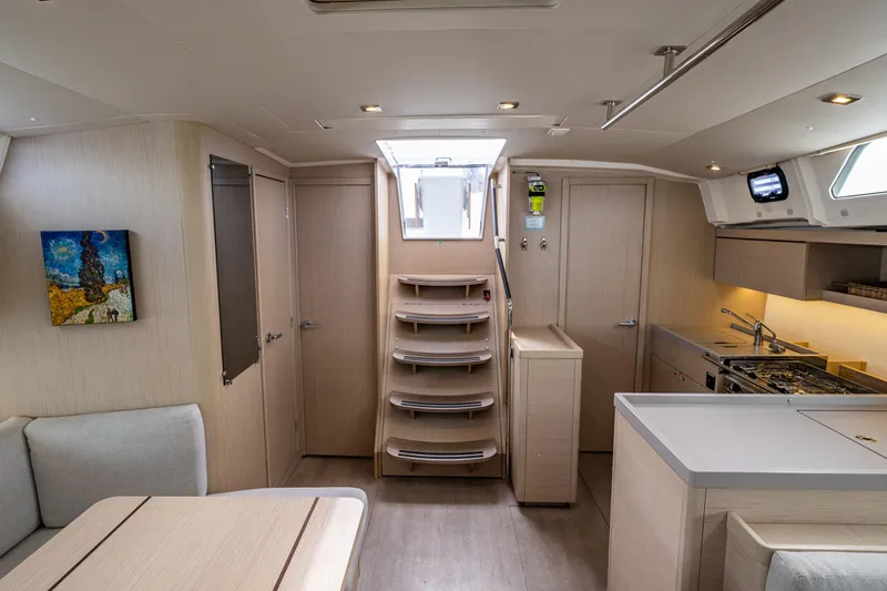 Cypress And Star II Yacht Photos Pics Interior of 2020 Beneteau Oceanis 46.1 yacht, featuring modern kitchen and seating area.