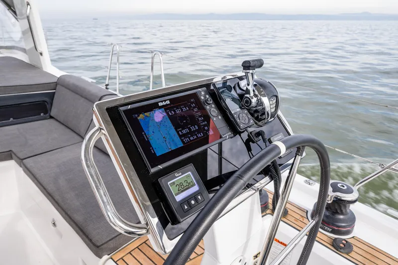 Cypress And Star II Yacht Photos Pics Cockpit of 2020 Beneteau Oceanis 46.1 with navigation equipment and steering wheel.