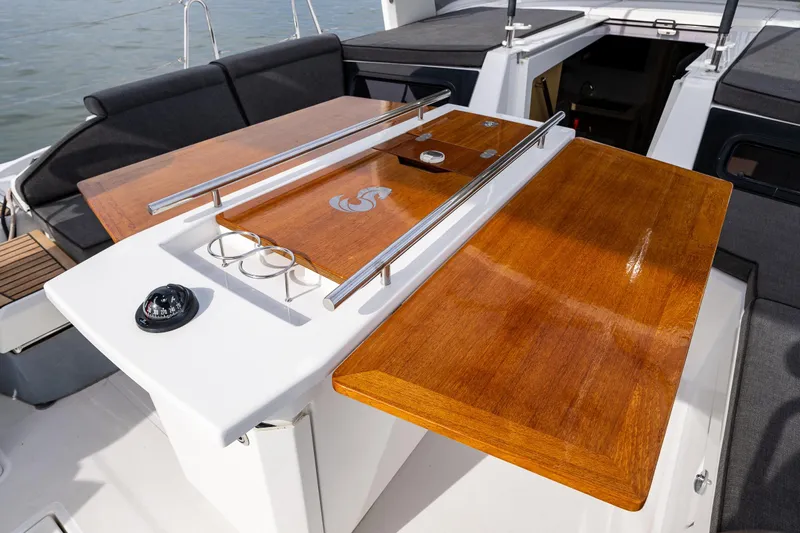 Cypress And Star II Yacht Photos Pics Cockpit of 2020 Beneteau Oceanis 46.1 yacht with wooden table and seating.