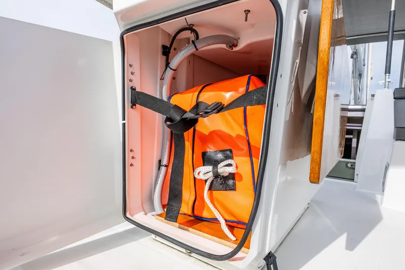 Cypress And Star II Yacht Photos Pics Storage compartment on 2020 Beneteau Oceanis 46.1 yacht with orange safety equipment.