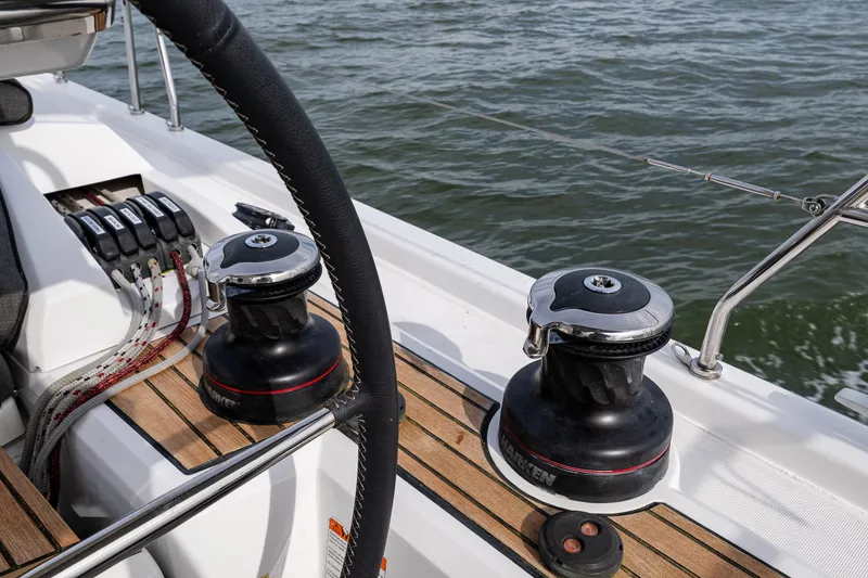 Cypress And Star II Yacht Photos Pics Cockpit view of 2020 Beneteau Oceanis 46.1 sailboat with winches and steering wheel.