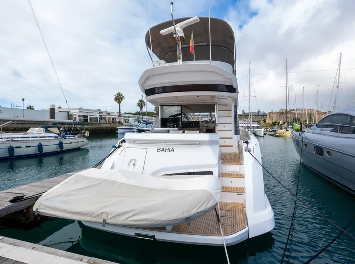  Yacht Photos Pics Azimut Fly 53 yacht, 2022 model, docked at marina with covered tender.