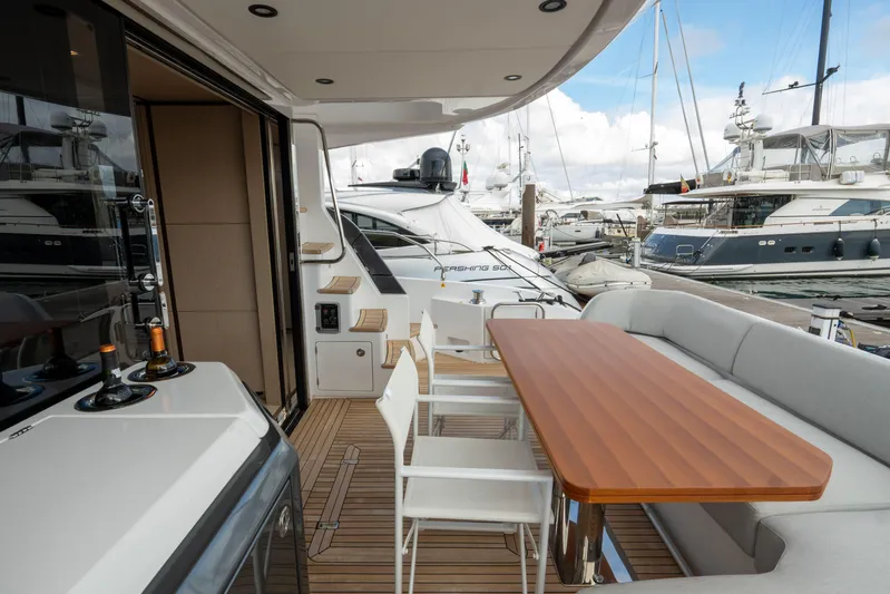  Yacht Photos Pics Azimut Fly 53 yacht deck, 2022 model, featuring elegant seating and dining area.