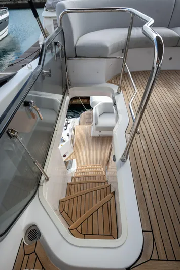  Yacht Photos Pics 2022 Azimut Fly 53 yacht with elegant wooden stairs and sleek design.