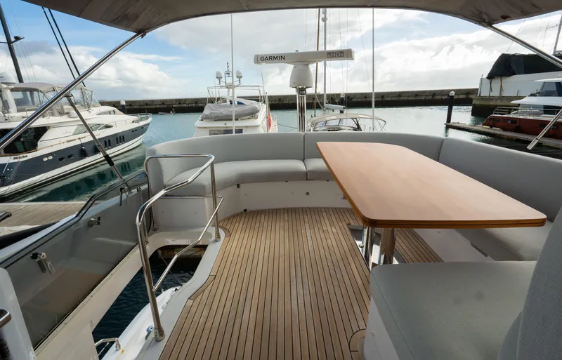  Yacht Photos Pics Luxurious 2022 Azimut Fly 53 yacht with spacious deck and elegant seating area.