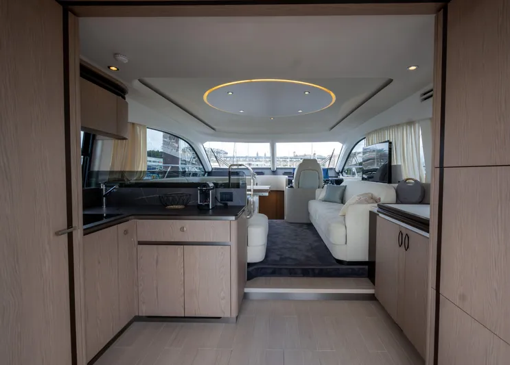  Yacht Photos Pics Luxurious interior of 2022 Azimut Fly 53 yacht with modern kitchen and seating area.