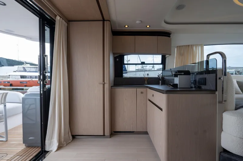  Yacht Photos Pics Modern interior of 2022 Azimut Fly 53 yacht, featuring sleek cabinetry and spacious design.