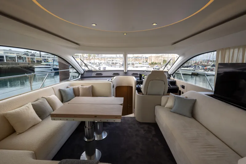  Yacht Photos Pics Luxurious interior of 2022 Azimut Fly 53 yacht with elegant seating and panoramic windows.