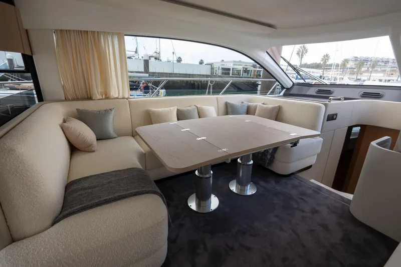  Yacht Photos Pics Luxurious interior of 2022 Azimut Fly 53 yacht with elegant seating and dining area.