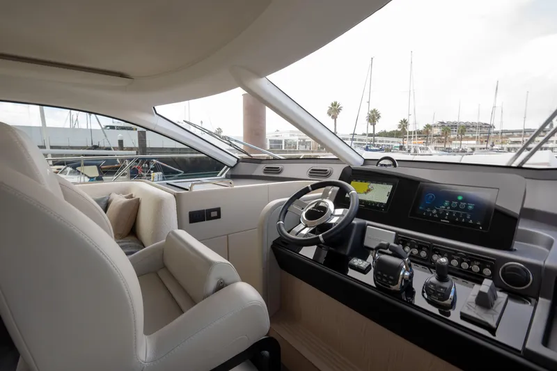  Yacht Photos Pics Luxurious interior of 2022 Azimut Fly 53 yacht with modern helm and controls.