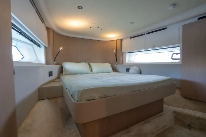  Yacht Photos Pics Luxurious bedroom interior of 2022 Azimut Fly 53 yacht with modern design and ambient lighting.