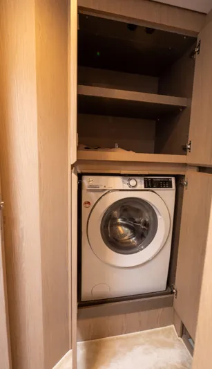  Yacht Photos Pics Washing machine in Azimut Fly 53 yacht, 2022 model, with wooden cabinetry.