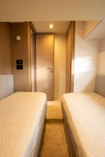  Yacht Photos Pics Luxurious twin cabin interior of 2022 Azimut Fly 53 yacht, featuring modern design and ambient lighting.