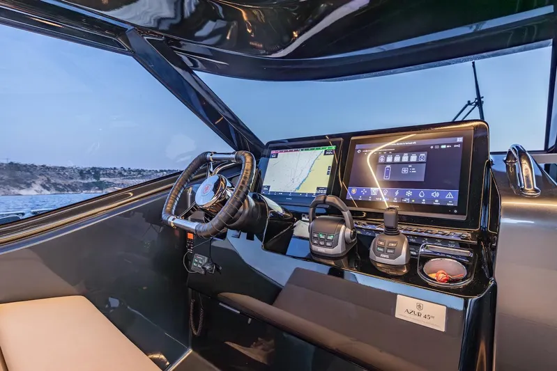  Yacht Photos Pics Helm of 2023 Bekkers Yachts Azur 45HT with advanced navigation displays and controls.