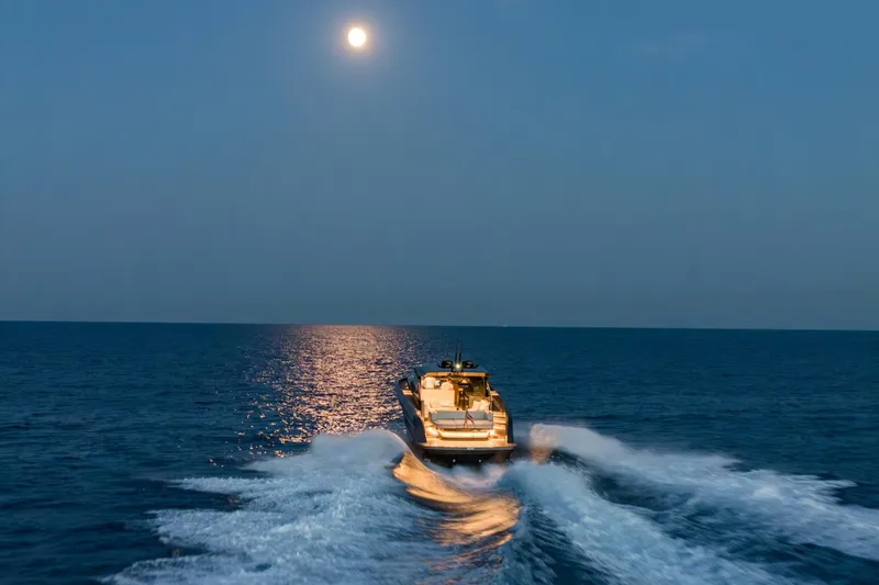  Yacht Photos Pics Bekkers Yachts Azur 45HT cruising under moonlight, 2023 model, creating waves on open sea.