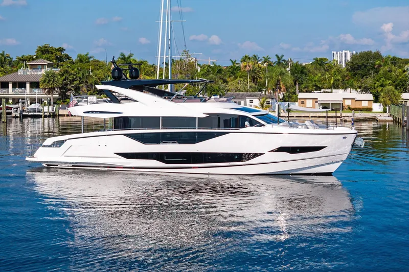 Don Tortuga Yacht Photos Pics 2024 Sunseeker 90 Ocean yacht cruising on a serene waterway.