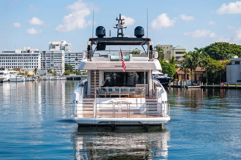 Don Tortuga Yacht Photos Pics 2024 Sunseeker 90 Ocean yacht docked in a scenic marina setting.