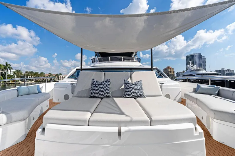 Don Tortuga Yacht Photos Pics Luxurious 2024 Sunseeker 90 Ocean yacht with elegant deck seating and sunshade.