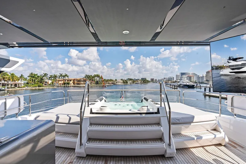 Don Tortuga Yacht Photos Pics Luxurious 2024 Sunseeker 90 Ocean yacht with jacuzzi, overlooking scenic waterfront views.