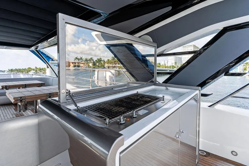 Don Tortuga Yacht Photos Pics Outdoor grill on 2024 Sunseeker 90 Ocean yacht, with scenic waterfront view.