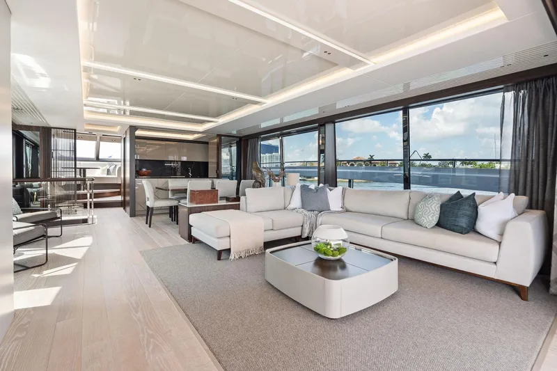 Don Tortuga Yacht Photos Pics Luxurious interior of 2024 Sunseeker 90 Ocean yacht with elegant seating and panoramic windows.
