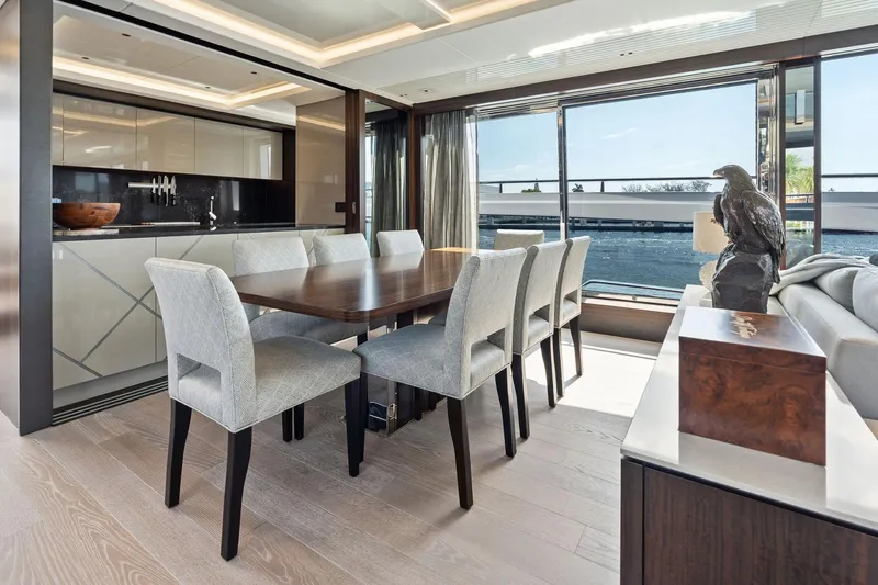 Don Tortuga Yacht Photos Pics Luxurious dining area on 2024 Sunseeker 90 Ocean yacht with elegant furnishings and ocean view.