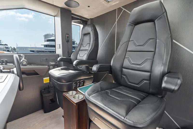 Don Tortuga Yacht Photos Pics Interior of 2024 Sunseeker 90 Ocean yacht with luxurious black leather seats.