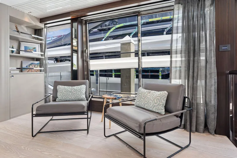 Don Tortuga Yacht Photos Pics Luxurious interior of 2024 Sunseeker 90 Ocean yacht with modern seating and large windows.