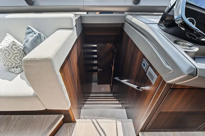 Don Tortuga Yacht Photos Pics 2024 Sunseeker 90 Ocean yacht interior with elegant staircase and plush seating.