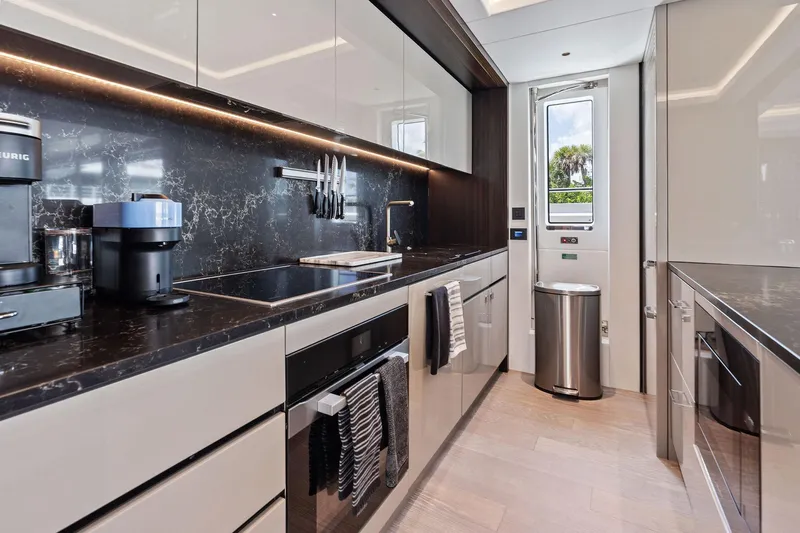 Don Tortuga Yacht Photos Pics Luxurious kitchen interior of 2024 Sunseeker 90 Ocean yacht with modern appliances.