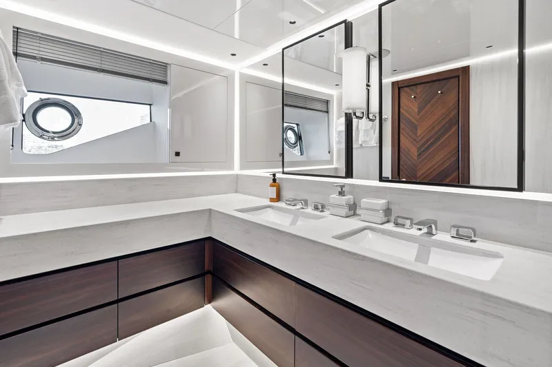 Don Tortuga Yacht Photos Pics Luxurious bathroom in 2024 Sunseeker 90 Ocean yacht with modern fixtures and elegant design.