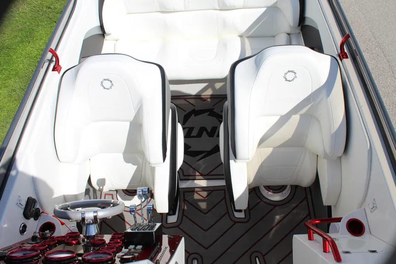 Lightning Yacht Photos Pics 2007 Fountain 42 Lightning boat interior with white seats and red accents.