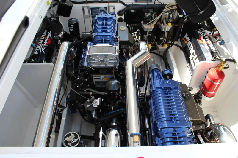 Lightning Yacht Photos Pics Engine compartment of a 2007 Fountain 42 Lightning boat, featuring dual blue superchargers.