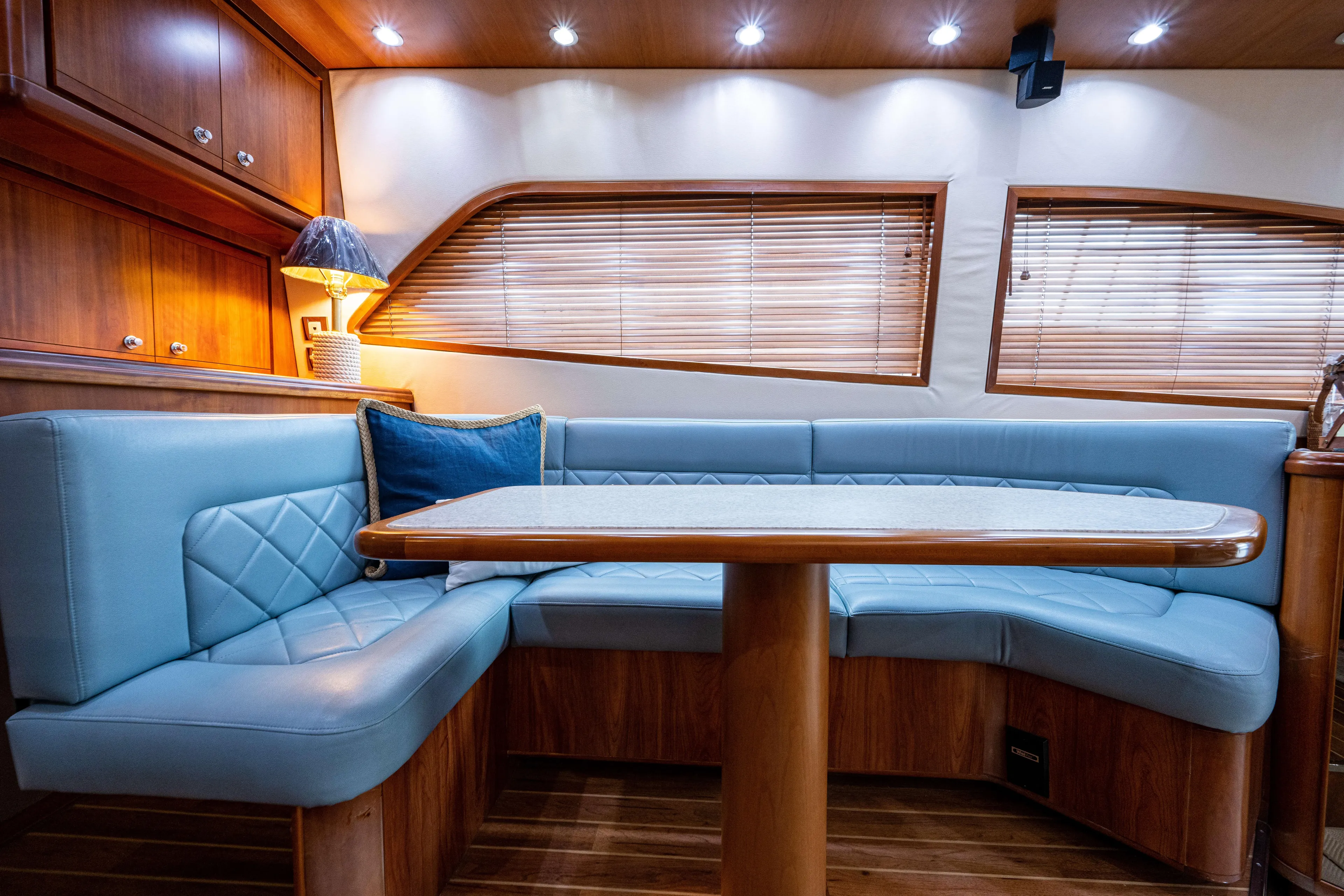 Nine Yacht Photos Pics Luxurious interior of 2008 Bertram 570 yacht with elegant seating and ambient lighting.