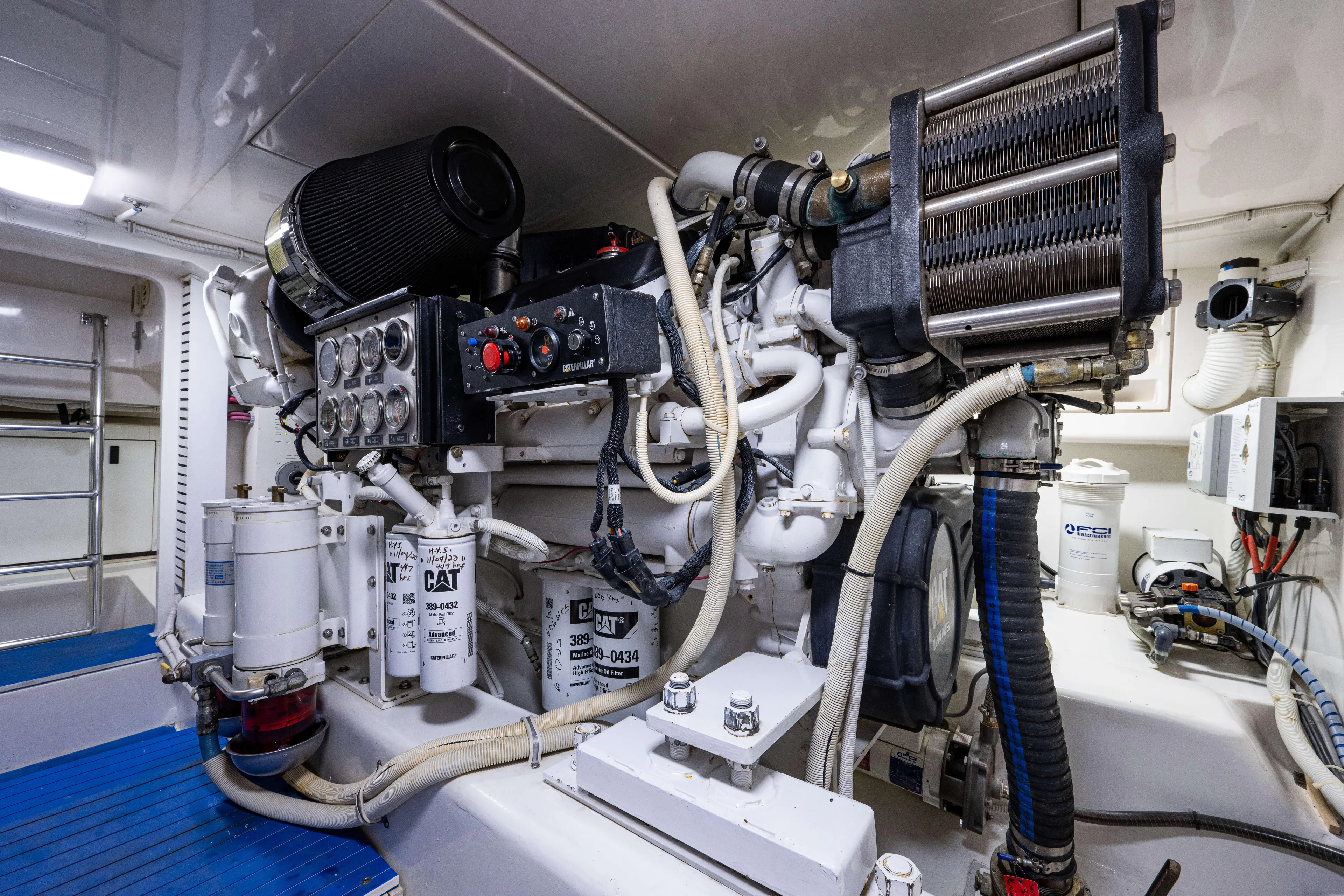 Nine Yacht Photos Pics Engine room of a 2008 Bertram 570 yacht, featuring CAT machinery and components.