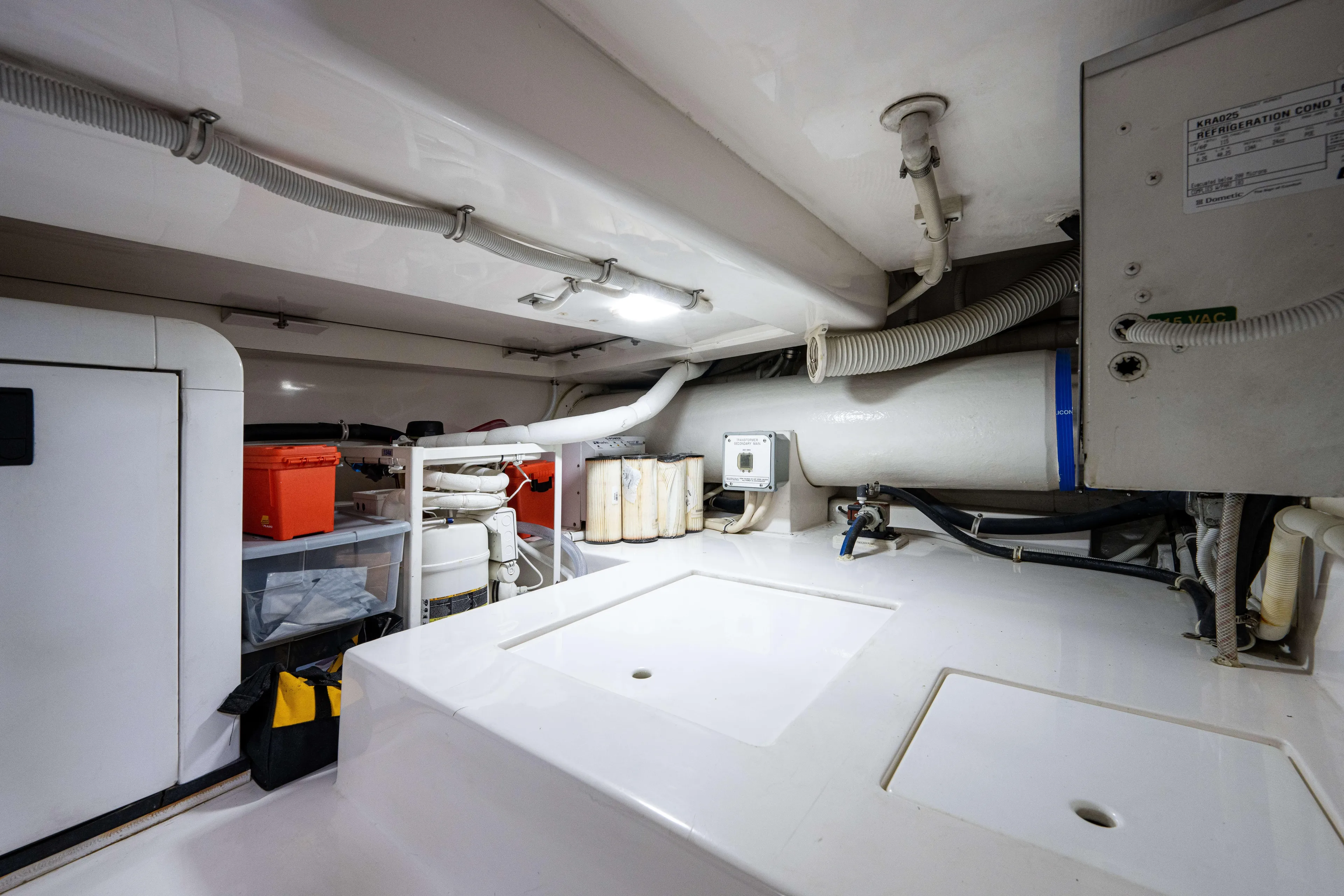 Nine Yacht Photos Pics Engine room of a 2008 Bertram 570 yacht, featuring storage and mechanical components.