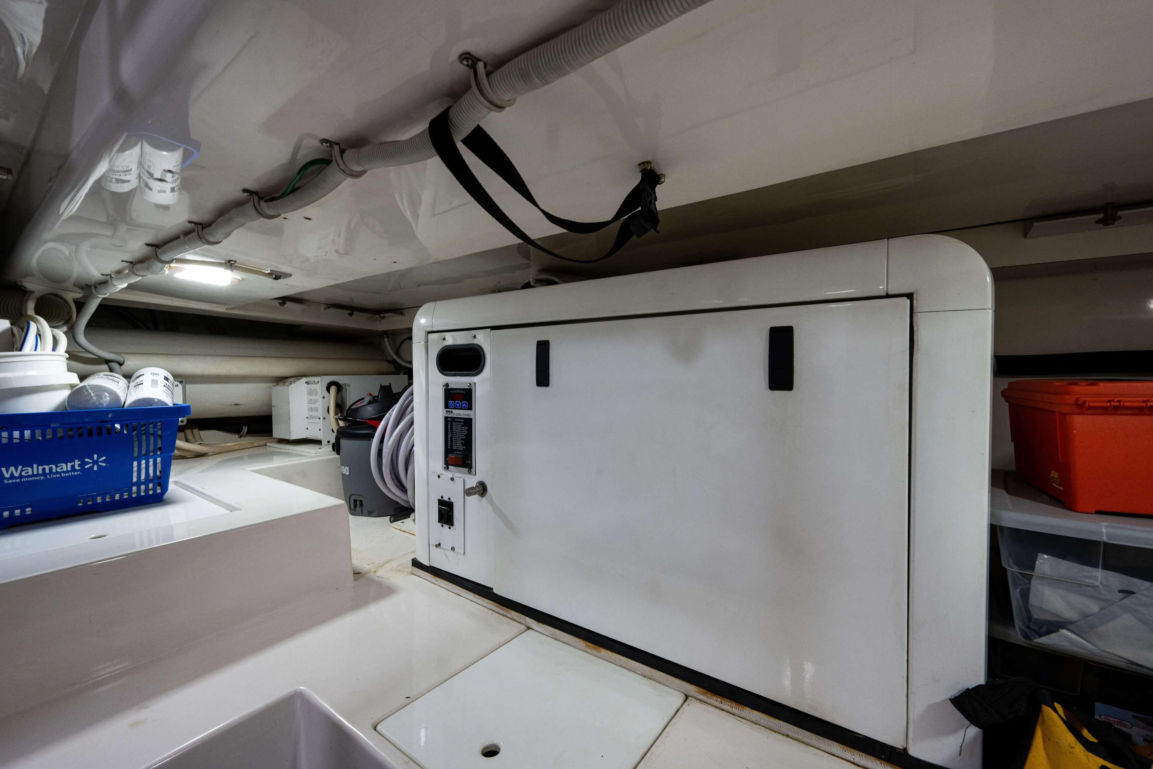 Nine Yacht Photos Pics Engine room of a 2008 Bertram 570 yacht with storage and equipment.