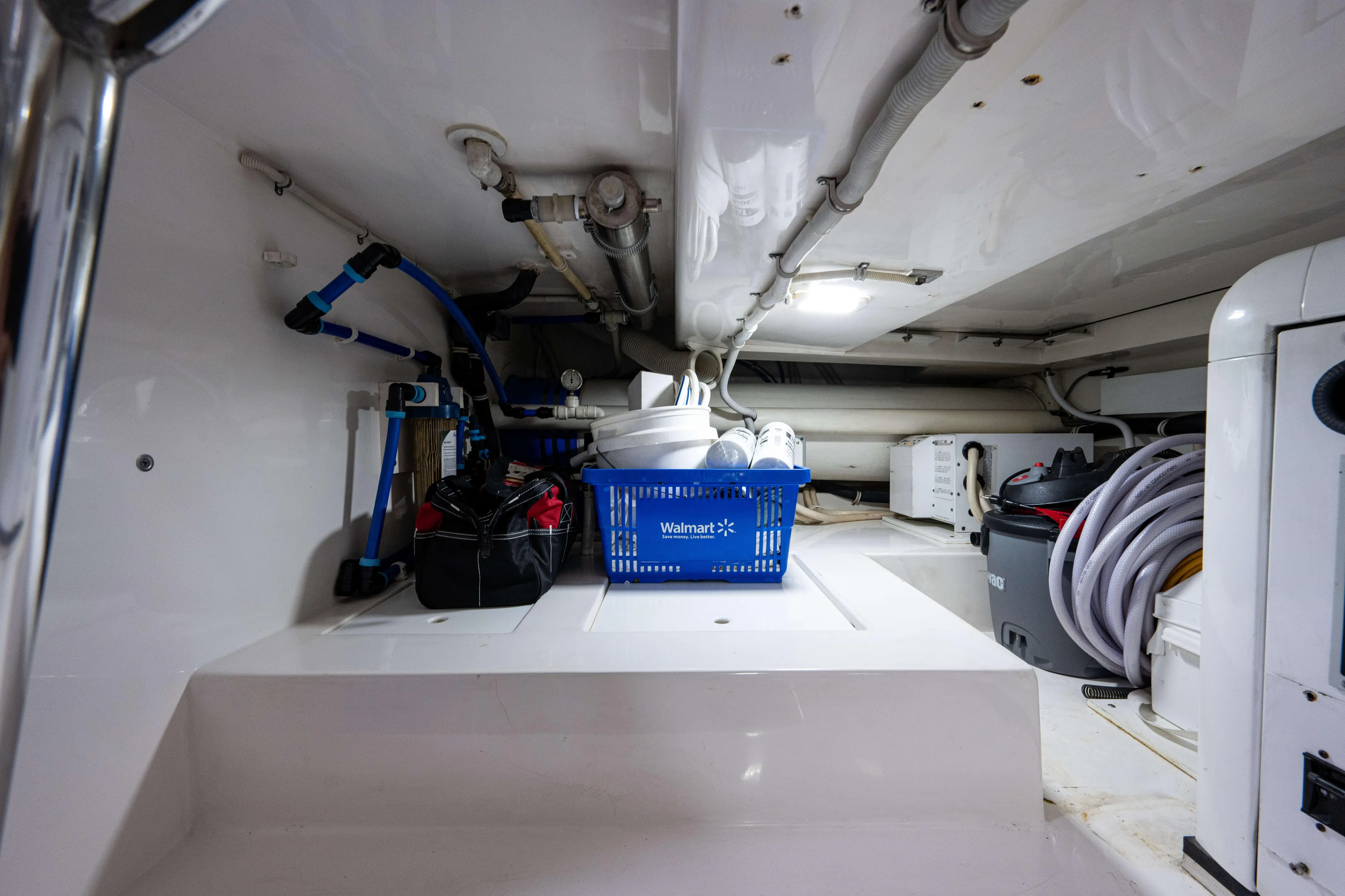 Nine Yacht Photos Pics Storage area in a 2008 Bertram 570 yacht with tools and equipment.