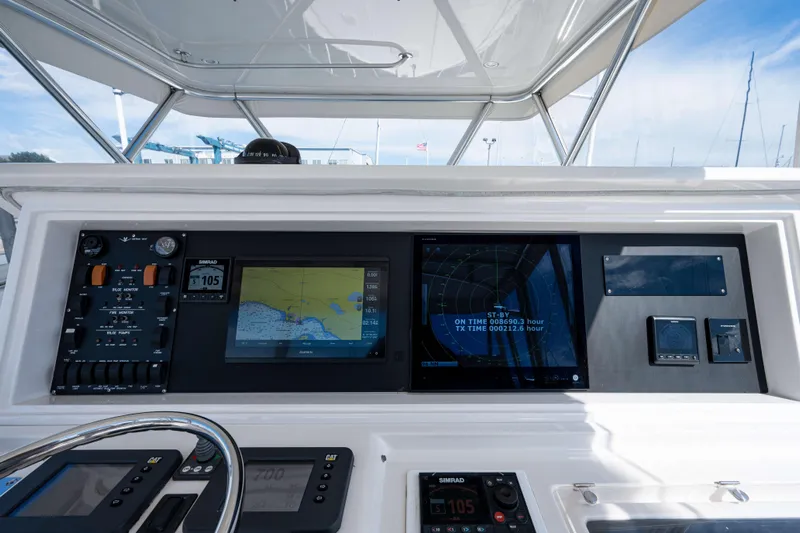 Nine Yacht Photos Pics 2008 Bertram 570 yacht dashboard with navigation and control panels.