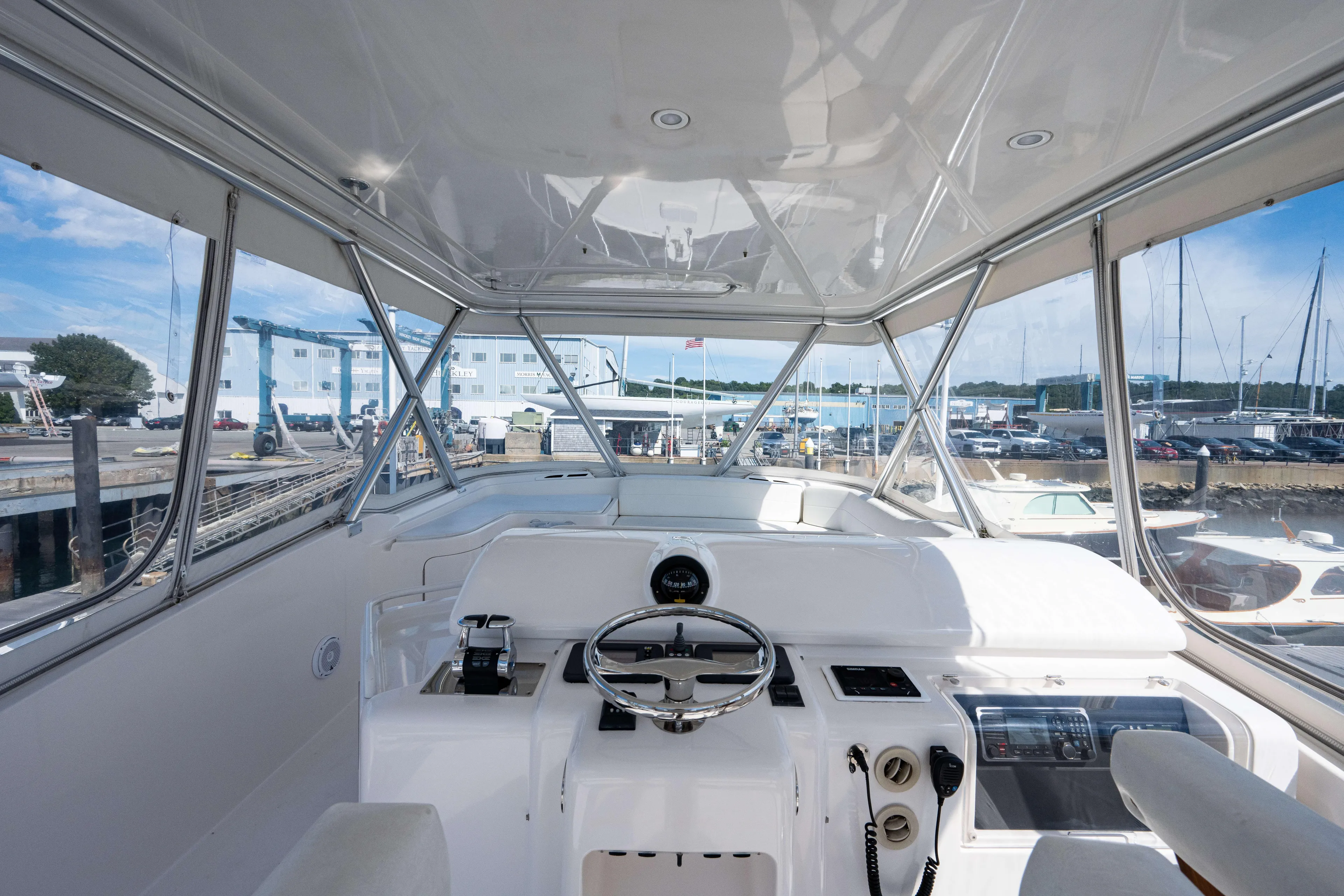 Nine Yacht Photos Pics Interior view of 2008 Bertram 570 yacht helm at marina.