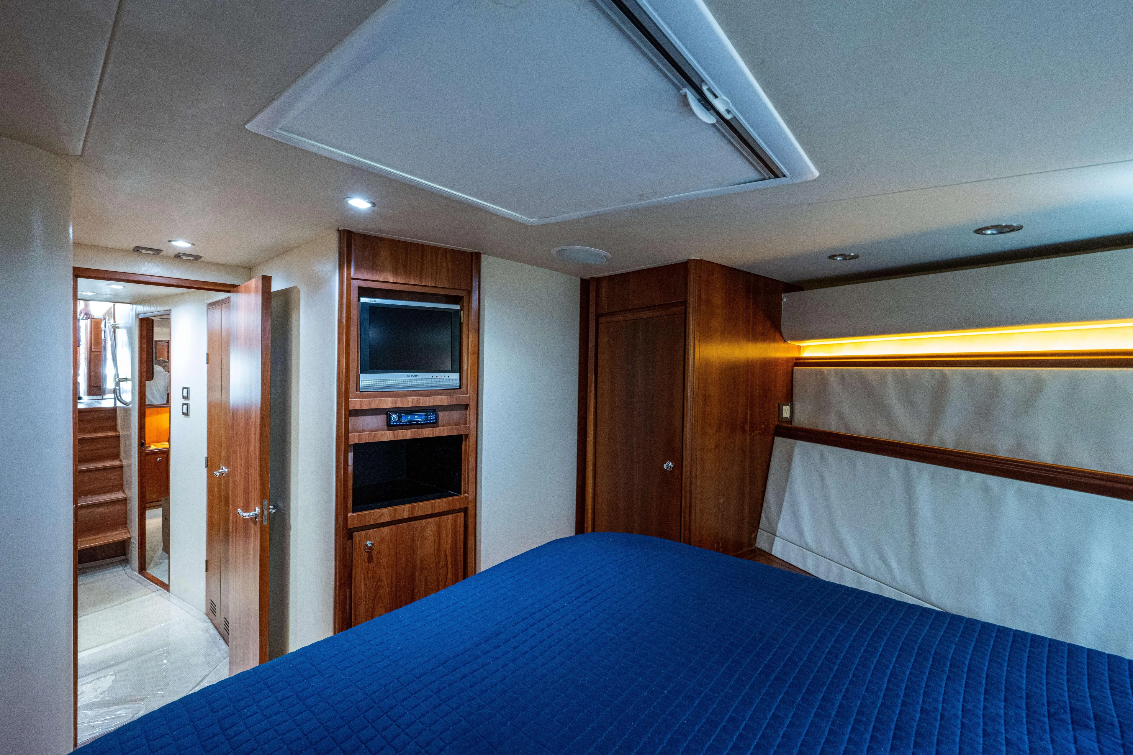Nine Yacht Photos Pics Luxurious 2008 Bertram 570 yacht interior with wood paneling and modern amenities.