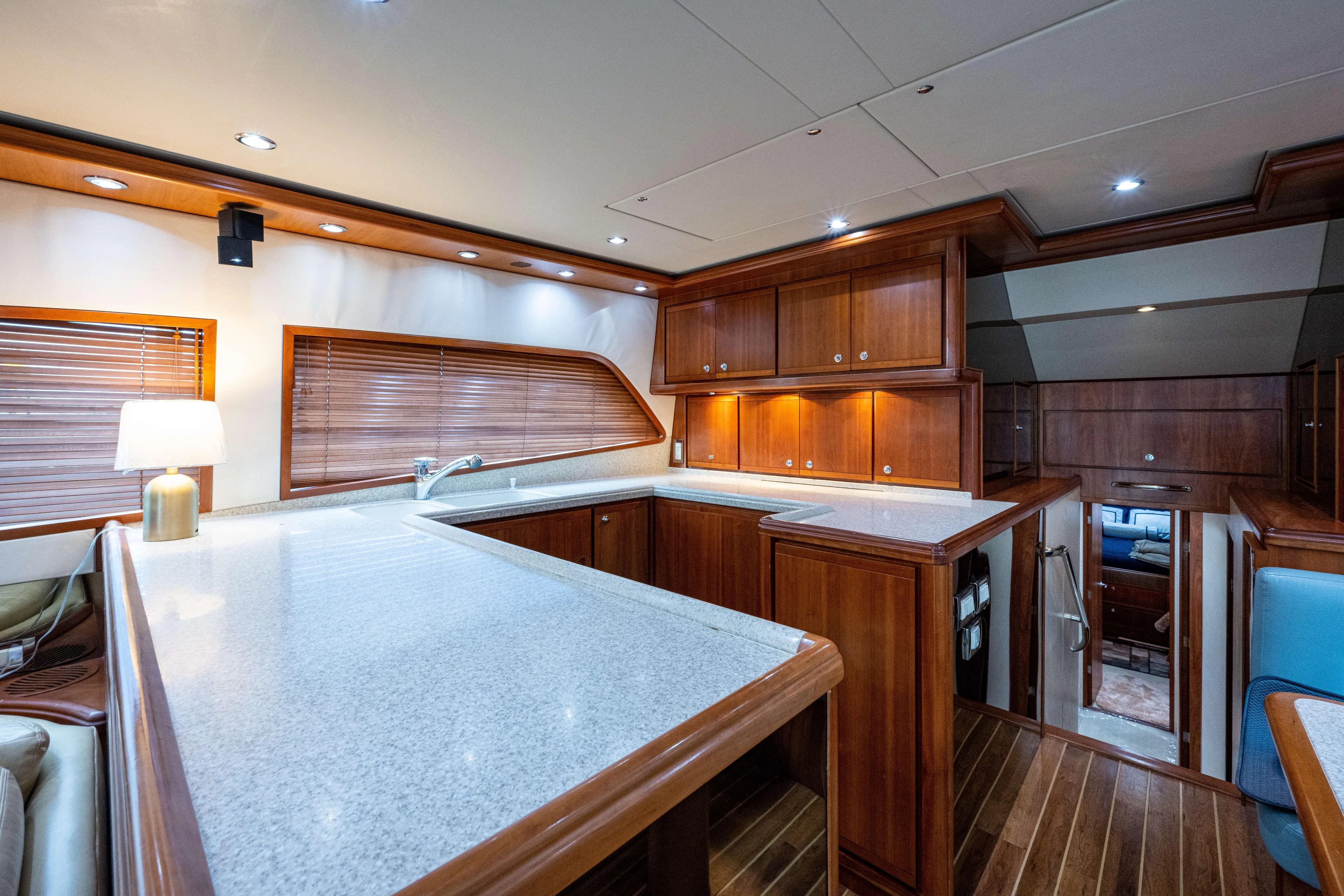 Nine Yacht Photos Pics Luxurious 2008 Bertram 570 yacht interior with elegant wood cabinetry and modern lighting.