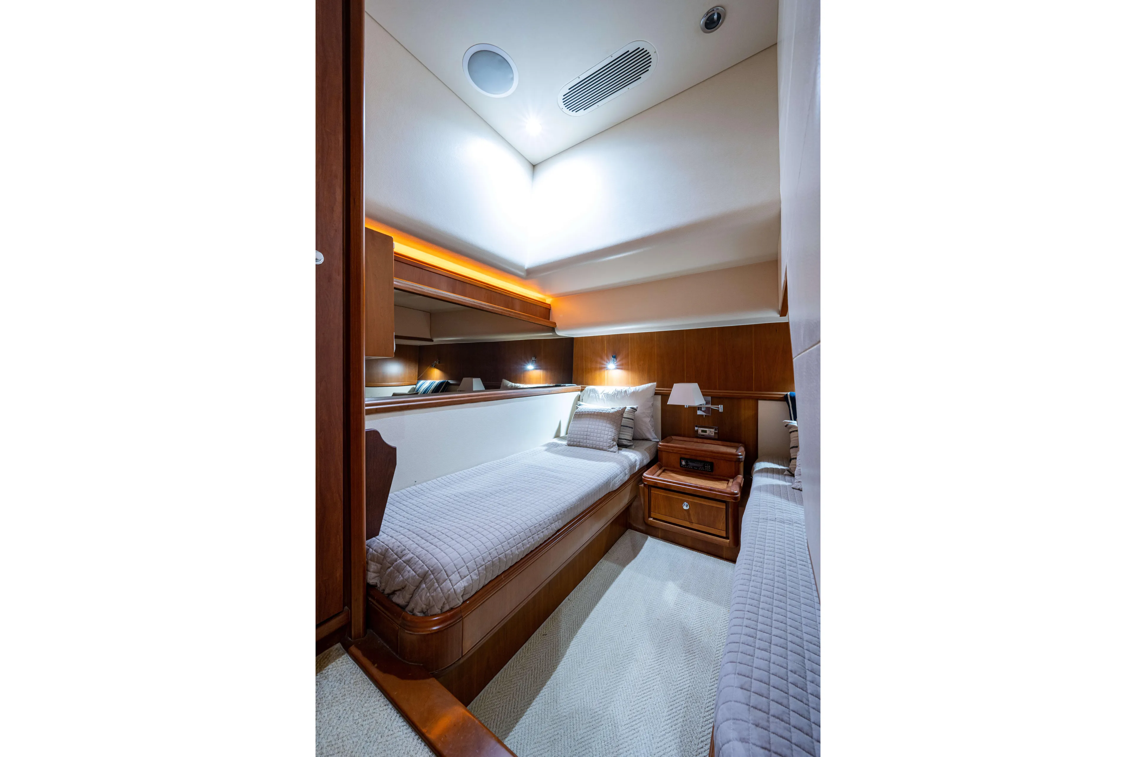 Nine Yacht Photos Pics Luxurious cabin interior of a 2008 Bertram 570 yacht with twin beds and elegant wood finish.
