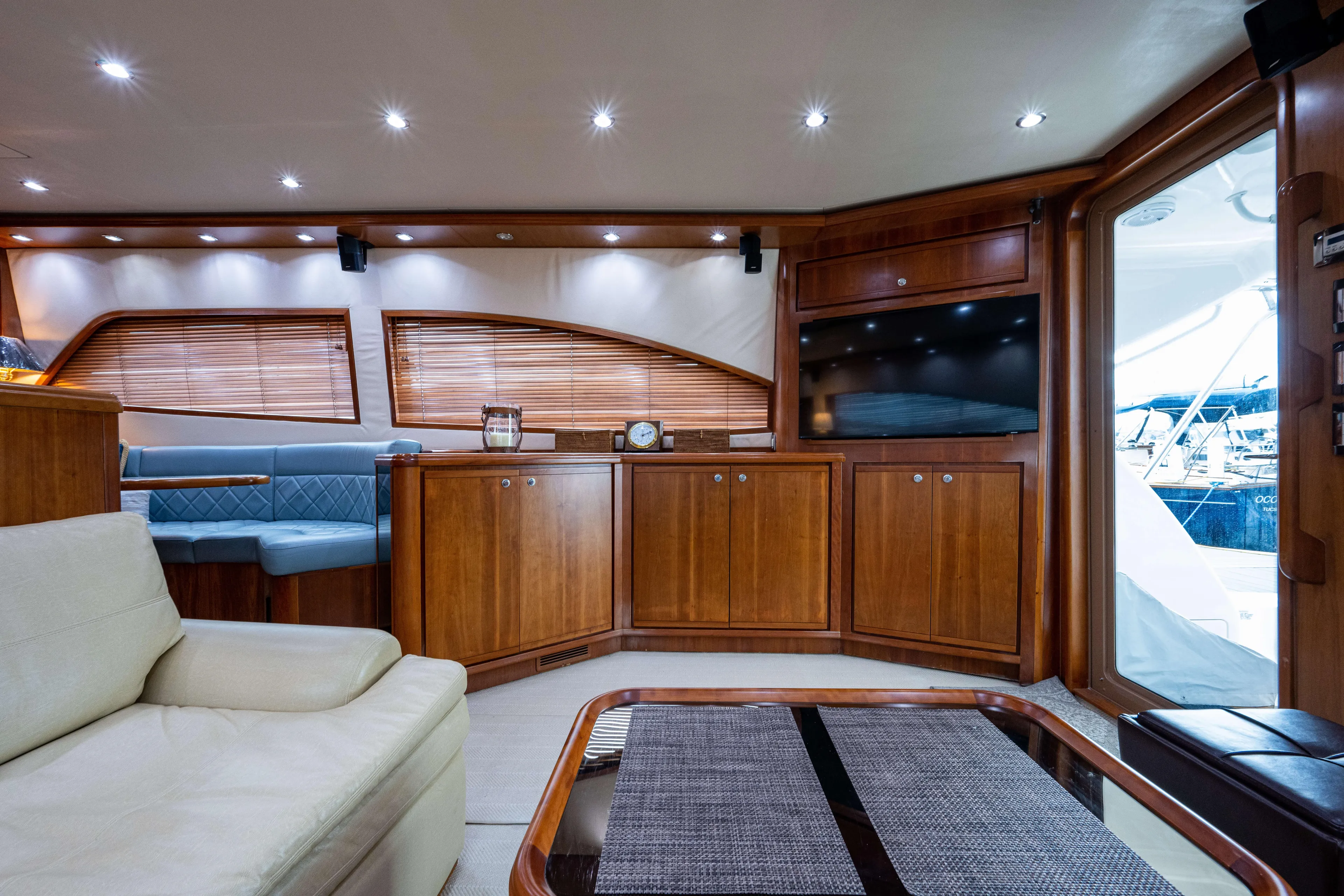 Nine Yacht Photos Pics Luxurious interior of 2008 Bertram 570 yacht with wooden cabinetry and modern furnishings.