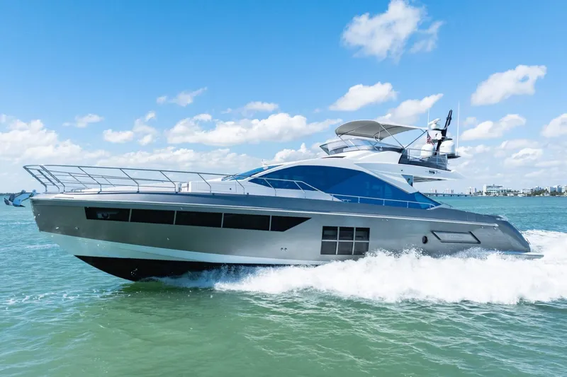 Azimut S7 Yacht Photos Pics 2019 Azimut S7 yacht cruising on open water under a clear blue sky.