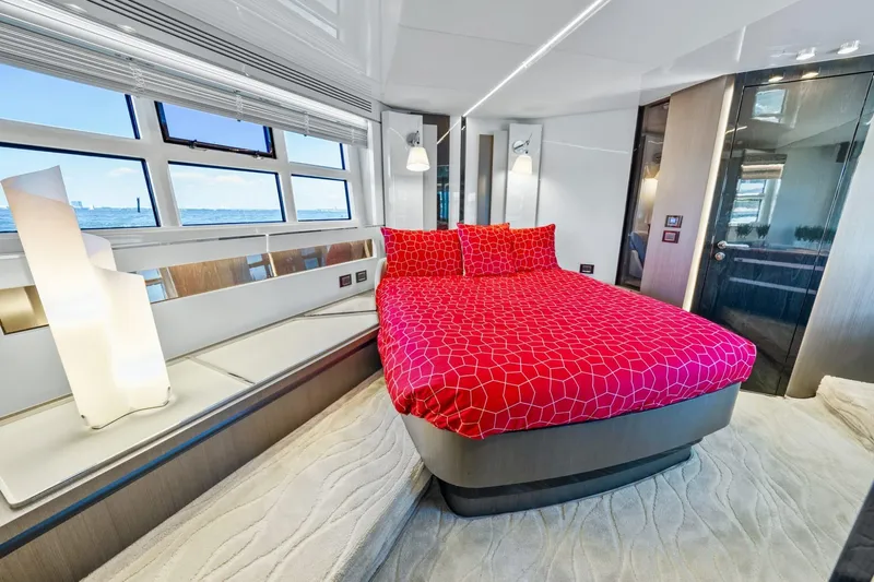 Azimut S7 Yacht Photos Pics Luxurious 2019 Azimut S7 yacht bedroom with red bedding and ocean view windows.