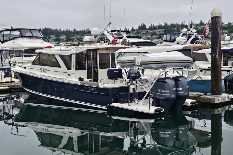  Yacht Photos Pics 2020 Cutwater C-32 C boat docked with Yamaha engines, surrounded by other vessels.