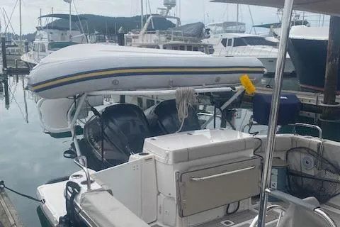  Yacht Photos Pics 2020 Cutwater C-32 C boat docked at marina with inflatable dinghy on top.