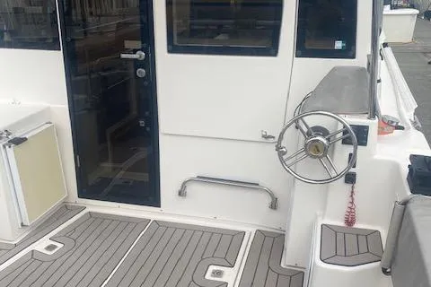  Yacht Photos Pics 2020 Cutwater C-32 C boat cockpit with steering wheel and deck view.