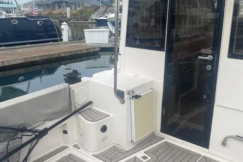  Yacht Photos Pics 2020 Cutwater C-32 C boat docked, featuring a clean deck and modern design.